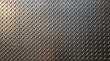 © DendraCreative - Black metal diamond plate texture background, industrial checkered steel sheet surface.