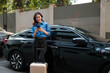 © Parichat - Young woman using smartphone for ride-sharing app