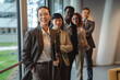 © Miljan Živković - Asian business woman leading diverse professional team at office