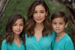 © Iryna - Mother posing with son and daughter in outdoor portrait