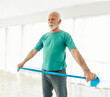 © Lumos sp - Senior couple exercise stretching and exercising with resistance band at home, health care and rehabalitation recovery concept