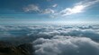© Bussakon - A stunning digital landscape view above the cloud layers overlaid with futuristic blue holographic data networks