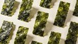 © Sundeesign27 - Crispy roasted seaweed nori sheets arranged in a pattern on light background, flat lay top view