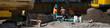 © knelson20 - Stormwater system pipe installation in progress, construction workers with 6 in green PVC pipes standing above excavated dirt trench on infrastructure work site