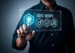 © Abu - Person touching a digital screen displaying I S O 9001 certification symbols hand