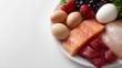 © Firadoaw - Assortment of healthy food including fruits vegetables fish meat and eggs isolated on white background, nutrition concept