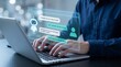 © Sadia - Man typing on laptop with chatbot interface on screen in office setting with blurred background