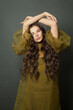 © millaf (Nemchinova) - Cute woman hair. Beautiful model with long curly hairstyle posing