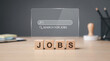 © Mike Stock - Recruitment concept with job blocks, laptop job board, and virtual search bar for careers and hiring