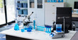 © NINENII - Science lab workspace with test tubes and equipment, research in action.