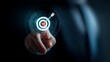 © sornram - A business professional interacts with a digital target interface, symbolizing precision and goal achievement in a modern and tech-driven environment.