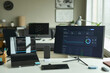 © Westend61 - Modern office desk with financial dashboard on monitor and laptop
