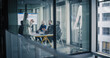 © Gorodenkoff - Business Team Meets in a Glass Conference Room to Review Digital Dashboards, Share Updates, and Agree on Clear Priorities, Turning Performance Data Into Simple Action Plans for Growth, Customer Value