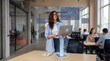 © Rendara Studio - Data analyst woman reviewing digital charts on laptop in modern office