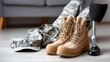 © lililia - Military boots and uniform on floor indoors, service concept, identity and readiness, lifestyle detail.