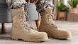 © lililia - Military boots and uniform placed indoors, service concept, readiness and identity, lifestyle detail.