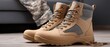 © lililia - Military boots and uniform placed indoors, service concept, readiness and identity, lifestyle detail.