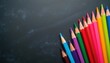 © Vadym - Colorful pencils arranged diagonally on dark textured surface create artistic composition. Bright drawing tools offer copy space for text. Ideal for art education creative projects. Background for