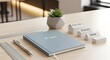 © AH Studio - Business planning and growth concept: Notebook, ruler, pen and small plant on desk