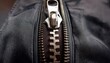 © Erin - close up view of zipper on fabric item showcasing metal teeth and slider mechanism highlighting its functionality and design