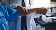 © Ketnapa - Doctor examining patient's elbow in hospital room
