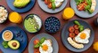 © RaniaKhairunnisa - Top view of a healthy breakfast spread with eggs toast and fresh fruits.
