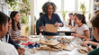 © SUCCESS HOLDINGS - Art teacher guiding diverse students during classroom cardboard craft project creative learning teamwork hands on education concept in bright school studio with recycled materials in workshop