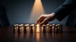 © wahyuni - Hand Selecting Glowing Figure From Crowd Of Wooden People Business Leadership Concept