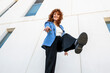 © VISTA by Westend61 - Smiling entrepreneur pointing at camera outdoors in Spain