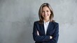 © Alexander Chaykin - A professional businesswoman posing for a photo. She is dressed in a suit and has a confident smile on her face, suggesting a successful career in corporate or executive roles.