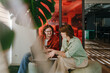 © BusinessClass by W61 - Colleagues discussing strategy with laptop in modern office