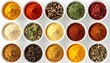 © Almahyra - Variety of colorful spices in white bowls on white background