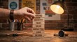 © Homestock Studio - Hand stacking wooden blocks with words BRAND, IDENTITY, TRUST, VALUE, MARKETING, LOGO, DESIGN to build a strong business concept.
