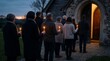 © Softcutai - People with candles outside church at dawn for Easter faith