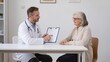 © zuchero - Medical consultation with senior woman and doctor