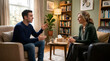 © logonv - Young man talking to woman psychologist during therapy session in office. Professional mental health support and counseling service. Dialogue between patient and therapist indoors.