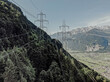 © MOODERN.foto - Hochspannungsleitungen und Strommasten in alpiner Berglandschaft, Instandhaltungsarbeiten an Freileitungen, Energieversorgung und Infrastruktur in den Schweizer Alpen