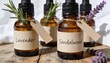 © Anna - Amber glass essential oil dropper bottles with lavender and sandalwood labels. Natural aromatherapy products with fresh herbs on a rustic wooden table. Organic skincare and holistic wellness