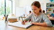 © Xenia - Smiling young girl drawing stars in a notebook at her desk in a classroom. Happy elementary student enjoying a creative art or science lesson