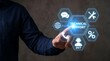 © CuteBee - Business professional touching a digital interface with technical support icons for 24/7 client communication and remote troubleshooting services in a modern business environment