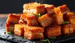 © Devistudio - Crispy Siu Yuk Roasted Pork Belly Cubes Glistening With Rendered Fat, A Close Up View
