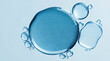 © Bohdan - Blue liquid bubbles with tiny particles