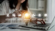 © InfiniteFlow - A person interacts with a laptop in a modern workspace, showcasing business innovation through a light bulb, highlighting financial analysis and digital marketing concepts effortlessly. Ledger