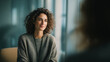 © Anastasiya Ri - Thoughtful young woman during psychotherapy session in modern counseling office creating calm emotional support and mental wellness concept