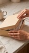 © Andrei - Faceless Hands Opening Gift Box with Tissue Paper on Marble for Premium Packaging and Unboxing