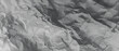 © Mukul - A grayscale illustration of a crumpled paper landscape with hills and valleys on a transparent background