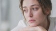 © Olga - Woman Looking Out Window with Sad Thoughtful Expression in Soft Light