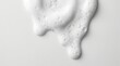 © design goodie - White cleansing foam with bubbles dripping on a light background for skincare product texture.