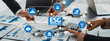 © InfiniteFlow - Professionals collaborate on green business strategies focusing on environmental, social, and governance principles, using digital tools and analytical charts to enhance decision-making. Amity