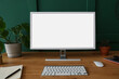 © Pixel-Shot - Modern computer, houseplant and notebook on wooden table near green wall